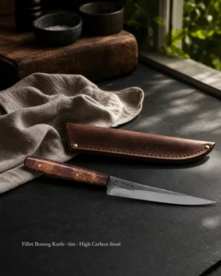 🔥🔪 SLENDER & SHARP 🔪🔥

Six inches of hand forged 420c Stainless Steel, built to work.

The Fillet Boning Utility Knife earns its keep where precision matters. 

Trimming close to the bone. Following the seam. Filleting clean without tearing through the flesh.

That slender blade with enough rigidity to use hard, and the hand-finished hardwood handle sits balanced in the palm... light enough for the fine work, strong enough for the field. 

Comes with its own leather sheath. Handmade, like everything we put our name to.

DM us or link in bio if you want one on block. 🔥